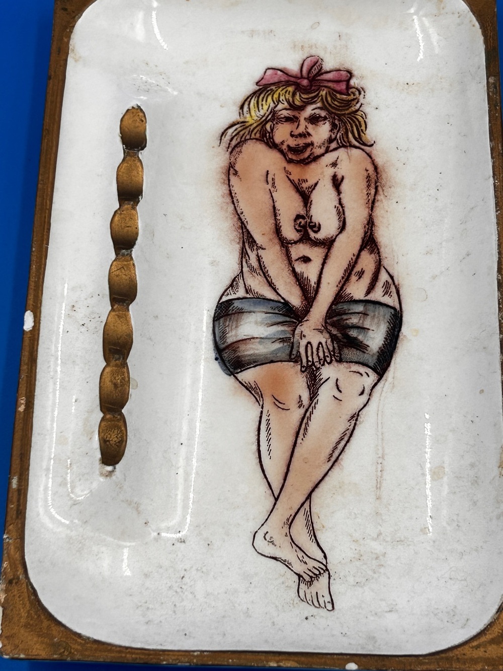 (PG)vintage-style ceramic tray or dish featuring a painted figure.Design